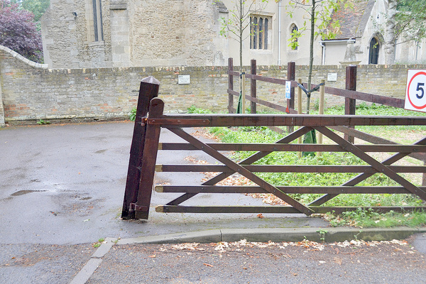 All Saints' damaged gate post
