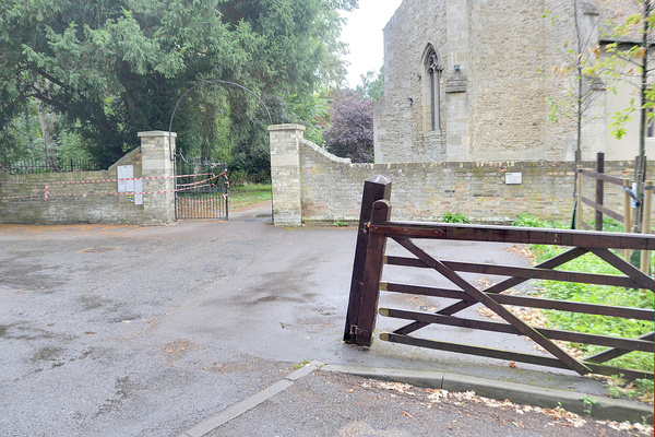 All Saints' damaged gate post and wall